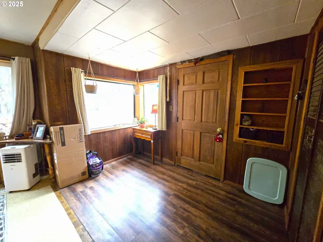 a bedroom with furniture and a window