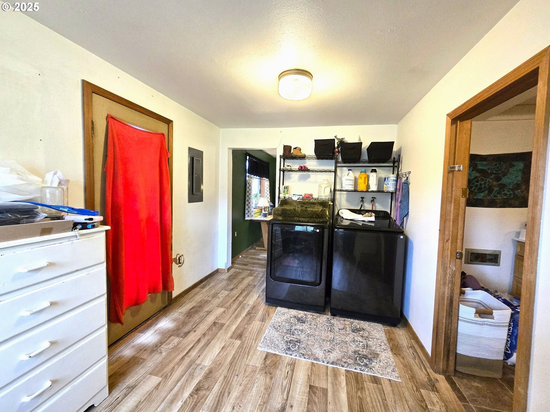 250 2nd Street Long Creek, OR 97856 - Photo 22 of 25 a kitchen with stainless steel appliances kitchen island granite countertop a refrigerator and stove