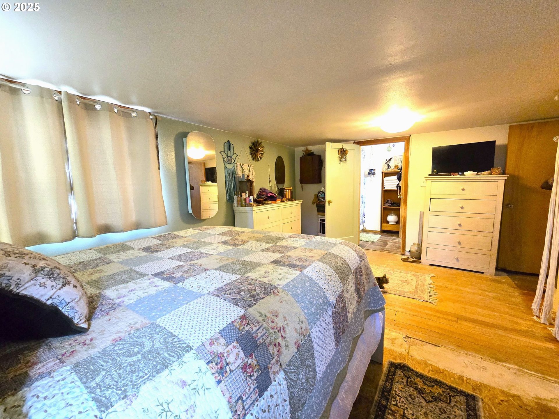 250 2nd Street Long Creek, OR 97856 - Photo 24 of 25 a spacious bedroom with a bed and walk in closet