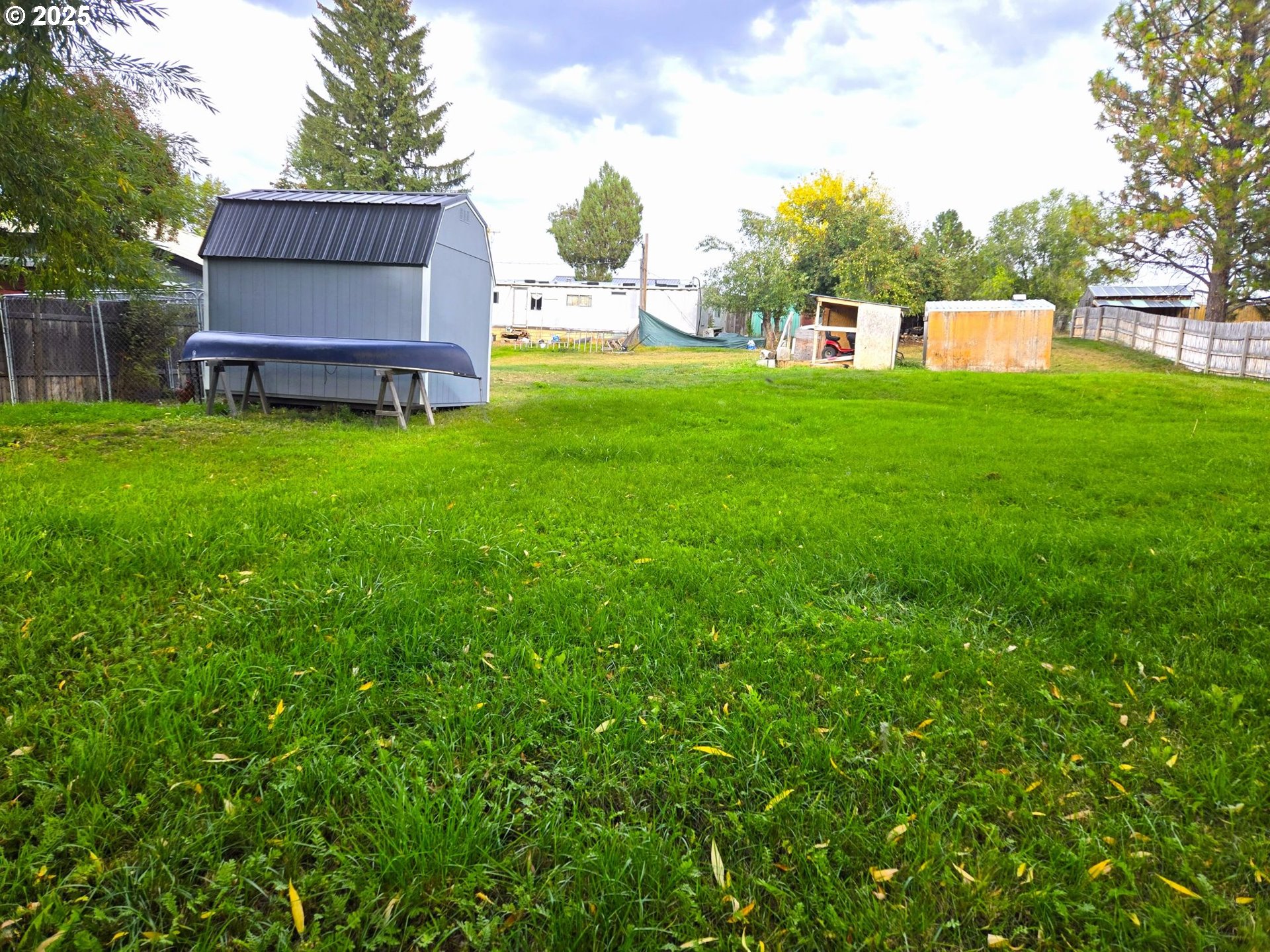 250 2nd Street Long Creek, OR 97856 - Photo 4 of 25 a view of a house with a yard and sitting area