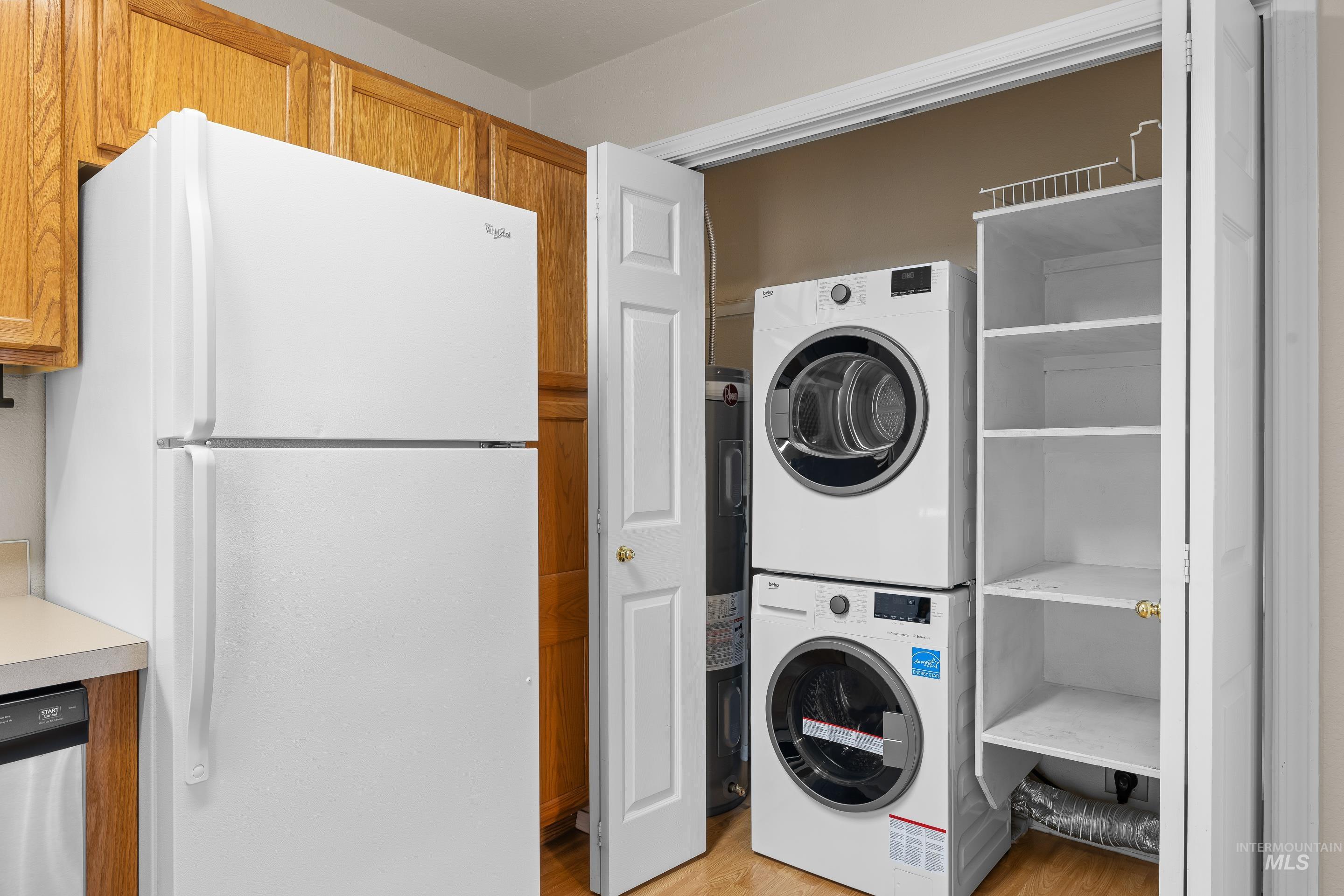 8909 West Irving Street, Unit 101 Boise, ID 83704 - Photo 13 of 33 stacked washing machine and dryer, and water heater
