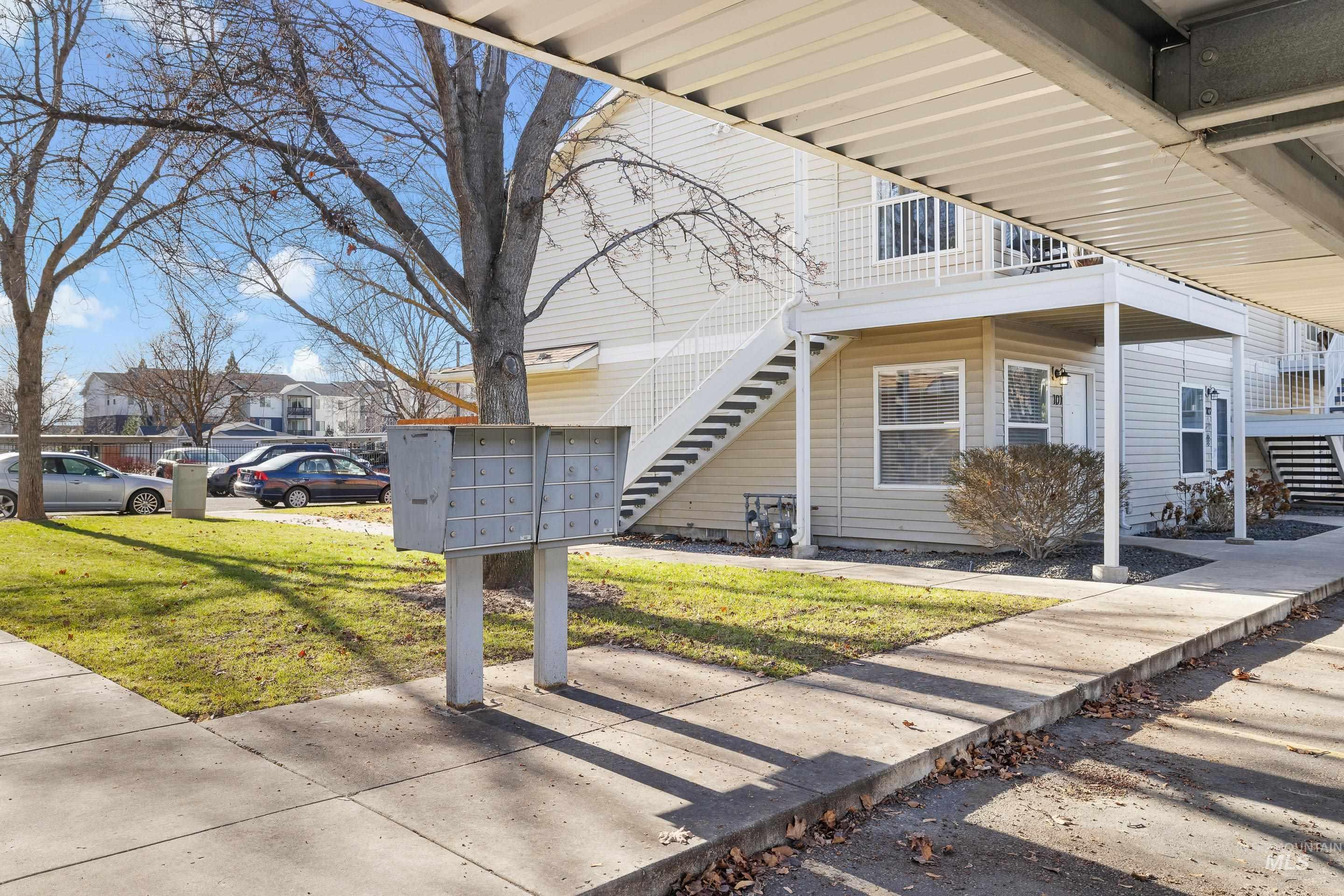 8909 West Irving Street, Unit 101 Boise, ID 83704 - Photo 29 of 33 Side View of property exterior mail area, and a common lawn area