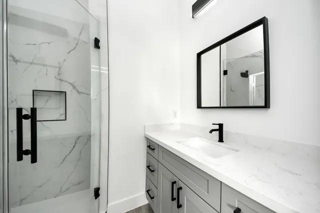 a bathroom with a sink and a mirror