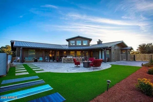 a view of a house with a yard porch and sitting area