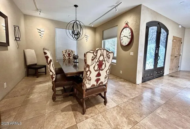 a room with lots of chairs and mirrors