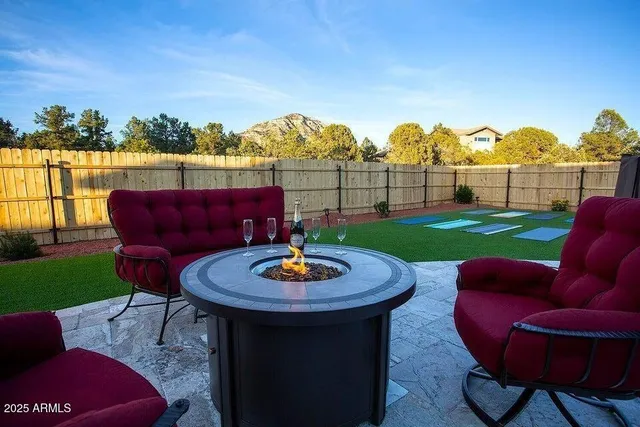 a bathroom with a granite countertop double vanity sink and a mirror