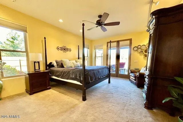 a bedroom with a bed and window