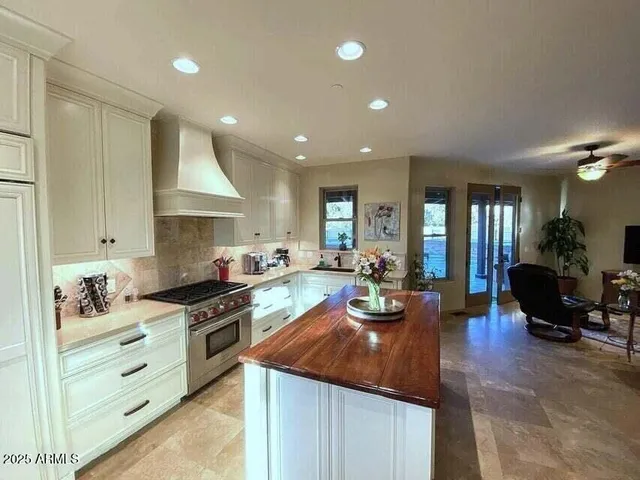 a spacious bathroom with a tub sink and mirror
