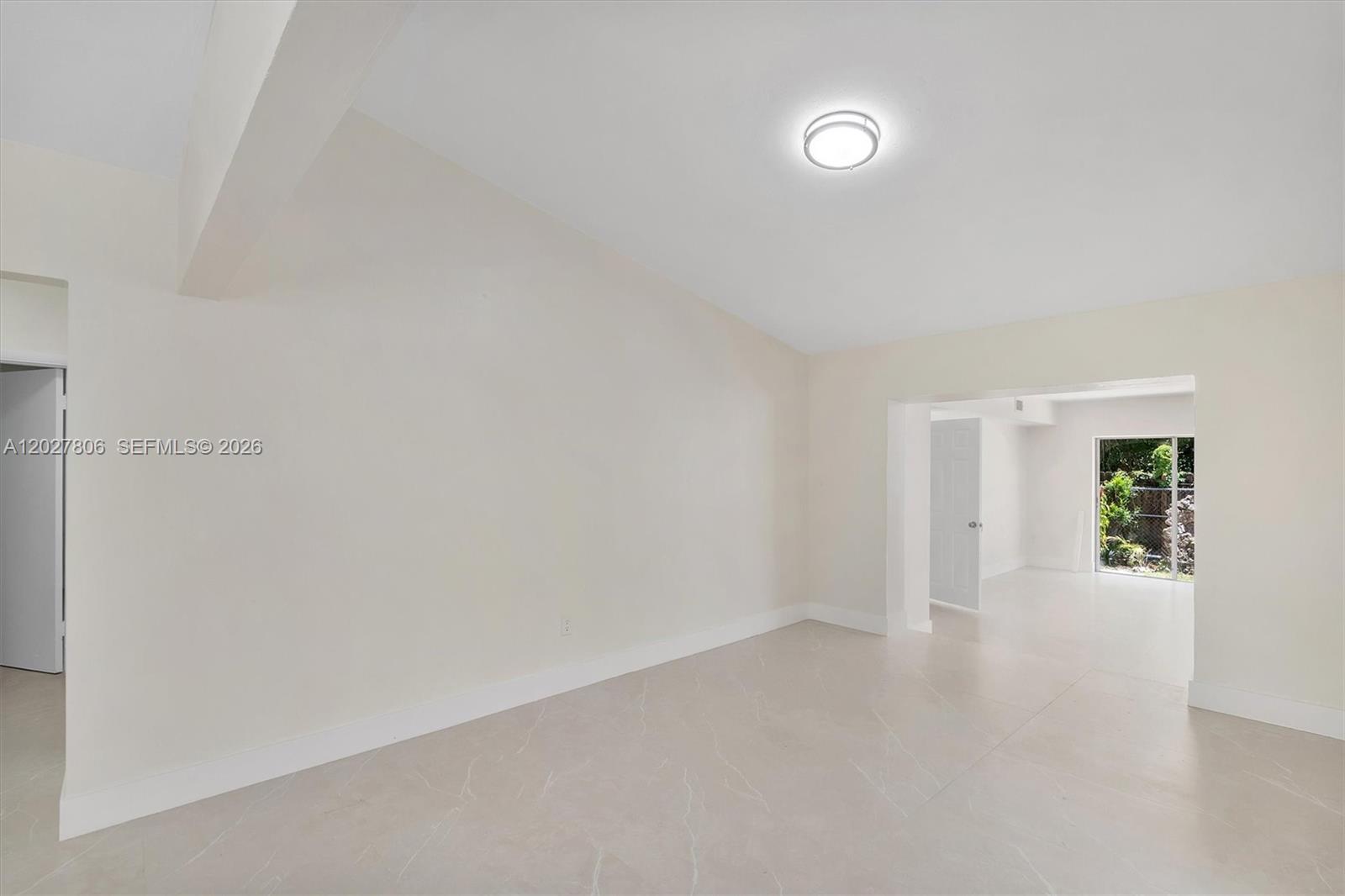 1612 Southwest 23rd Street, Unit 1612 Miami, FL 33145 - Photo 12 of 42 a view of an empty room with a window