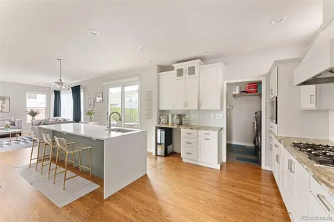 a large kitchen with a table and chairs in it