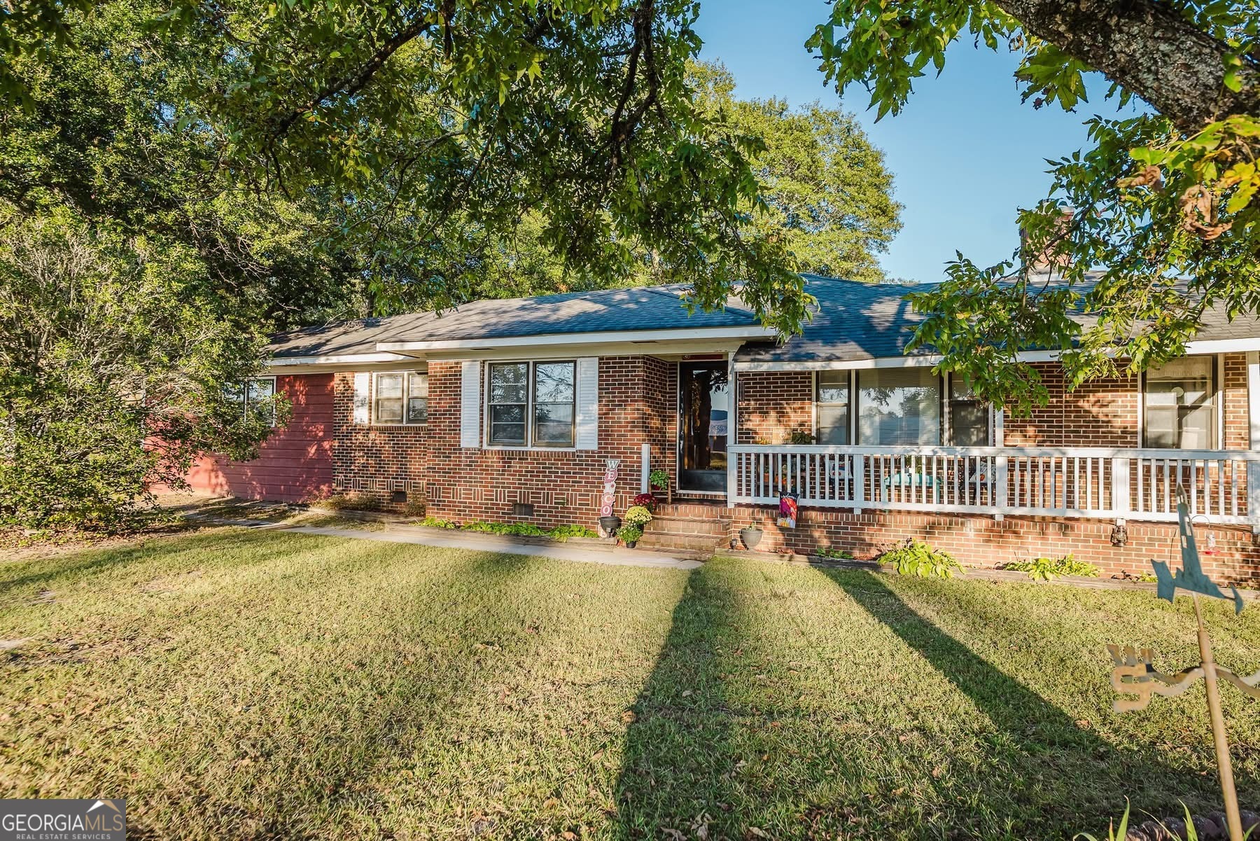 swimming pool view with a seating space and a garden view