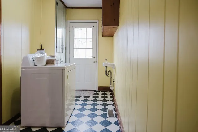 a bathroom with a sink mirror and a shower