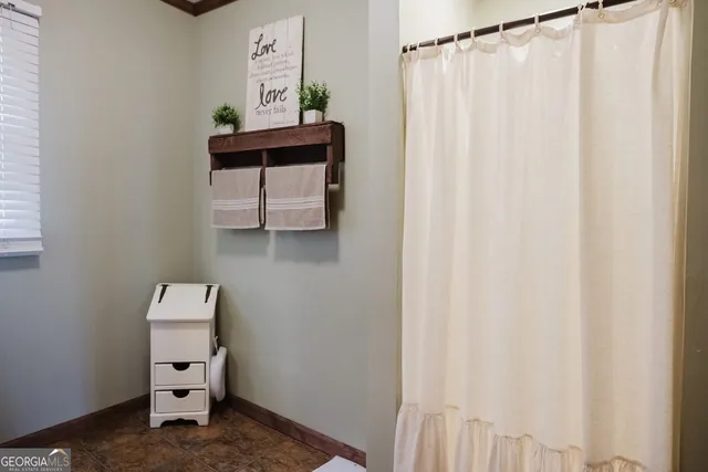 a bathroom with a sink toilet and mirror