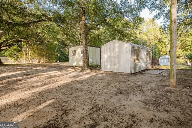 a view of a brick house with many windows
