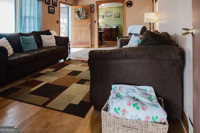 a living room with a bed and furniture