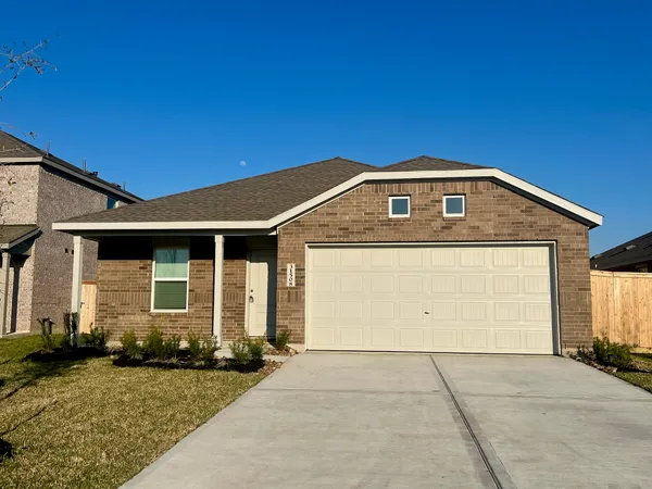 a front view of a house with yard