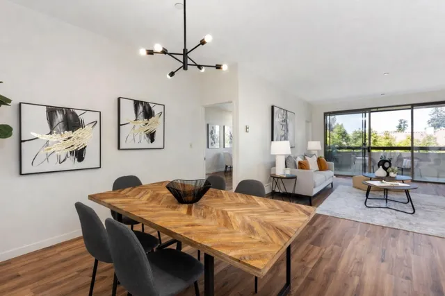 a view of a dining room with furniture window and wooden floor
