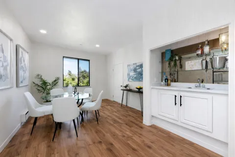 a view of kitchen island dining table and chairs