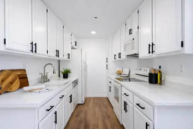 a kitchen with cabinets and a sink