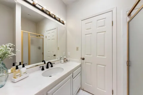 a bathroom with a sink and a mirror