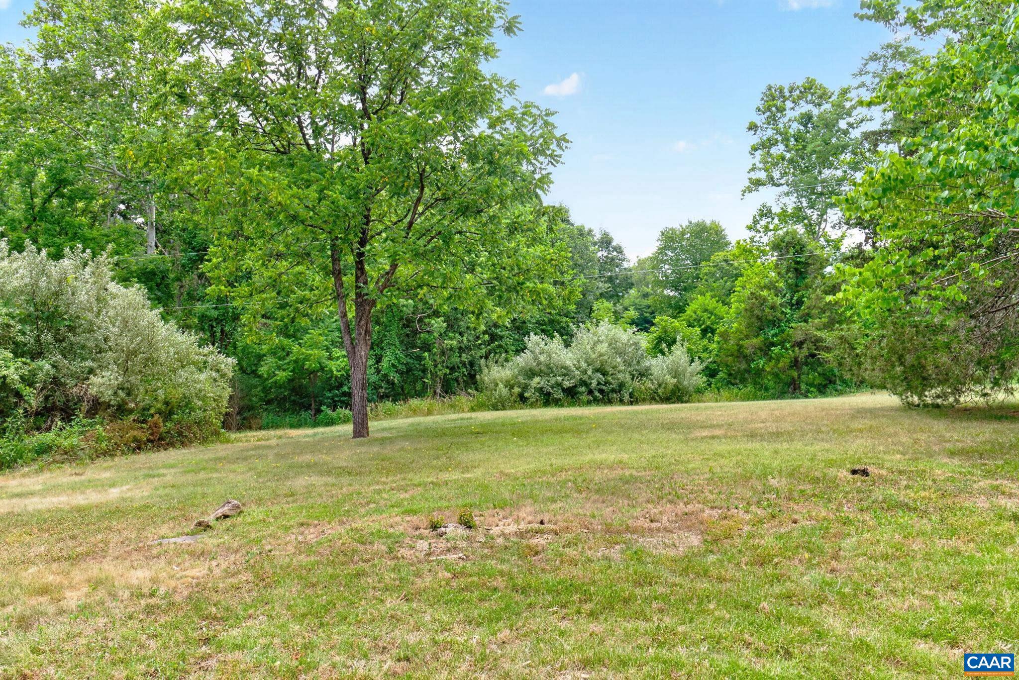 6285 Jarmans Gap Road Crozet, VA 22932 - Photo 55 of 65 a view of a field with a trees in the background