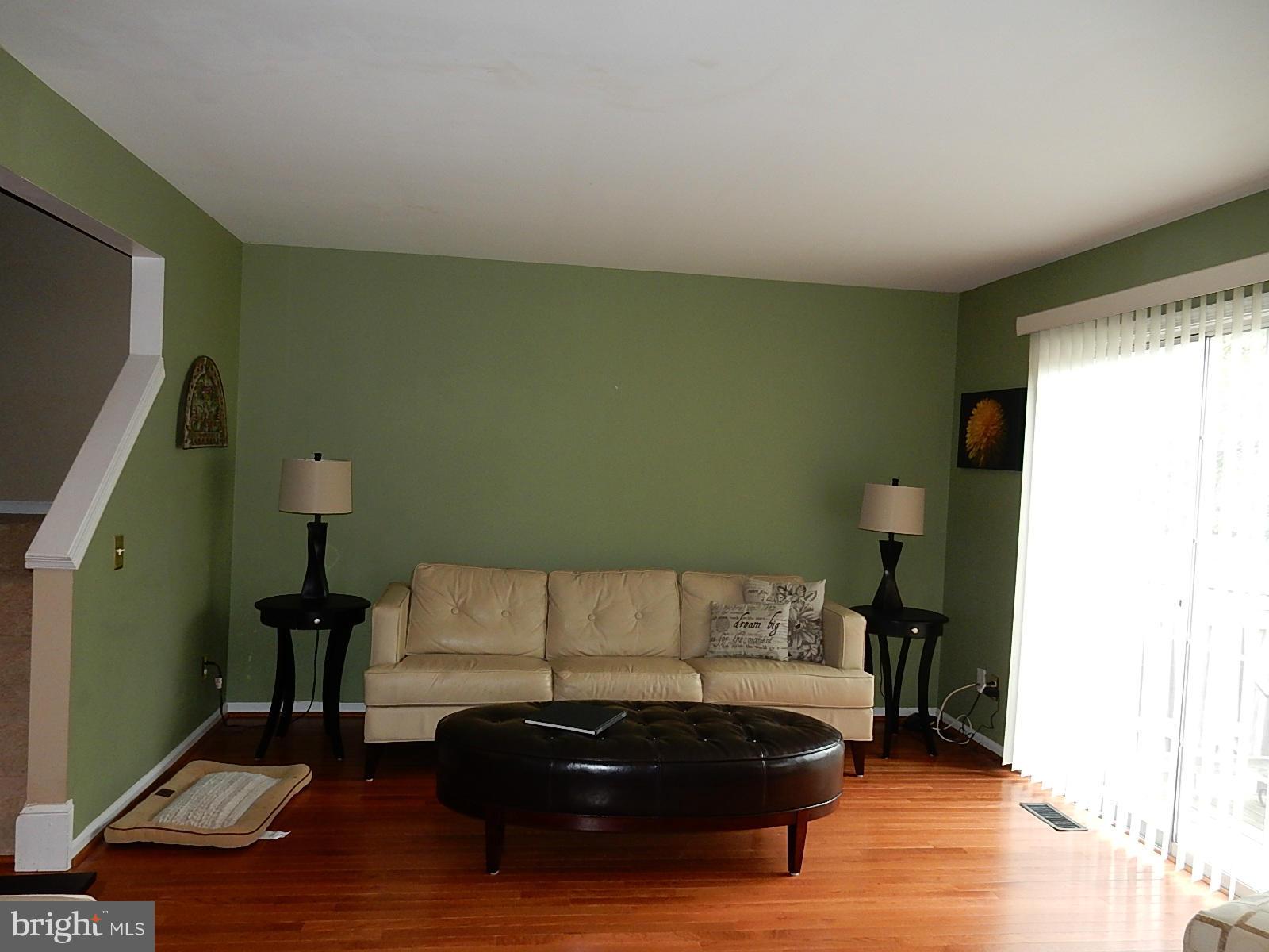 325 Millbrook Terrace Leesburg, VA 20176 - Photo 11 of 20 a living room with furniture and a flat screen tv