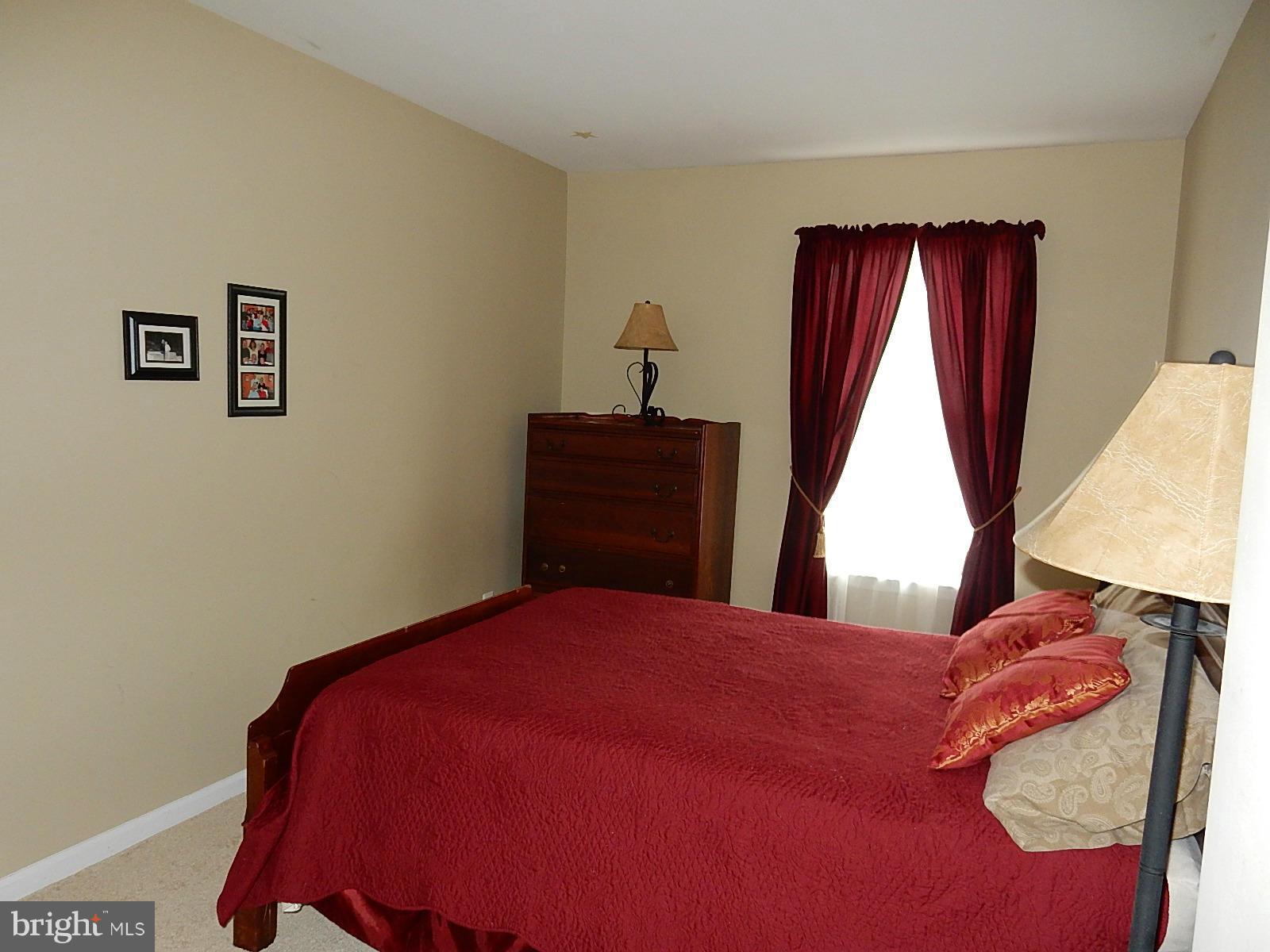 325 Millbrook Terrace Leesburg, VA 20176 - Photo 13 of 20 a bedroom with a bed and a window