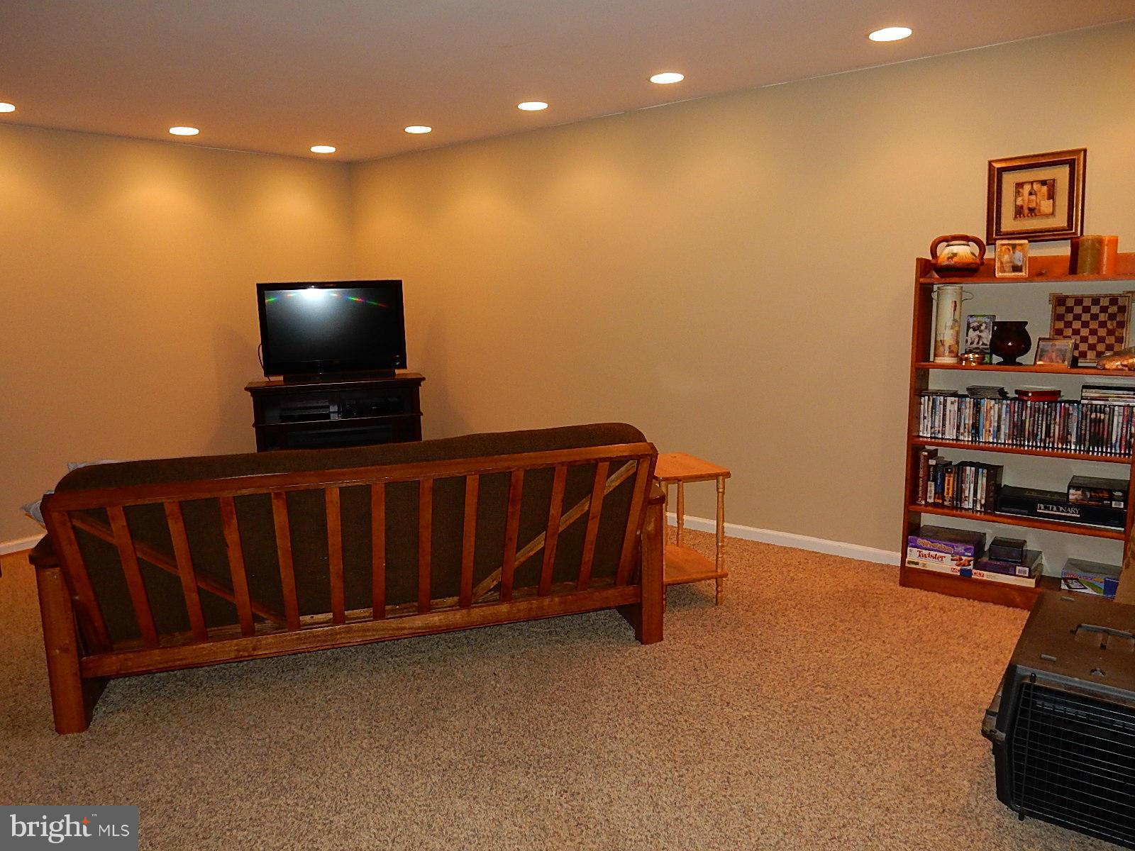 325 Millbrook Terrace Leesburg, VA 20176 - Photo 16 of 20 a living room with furniture and a flat screen tv