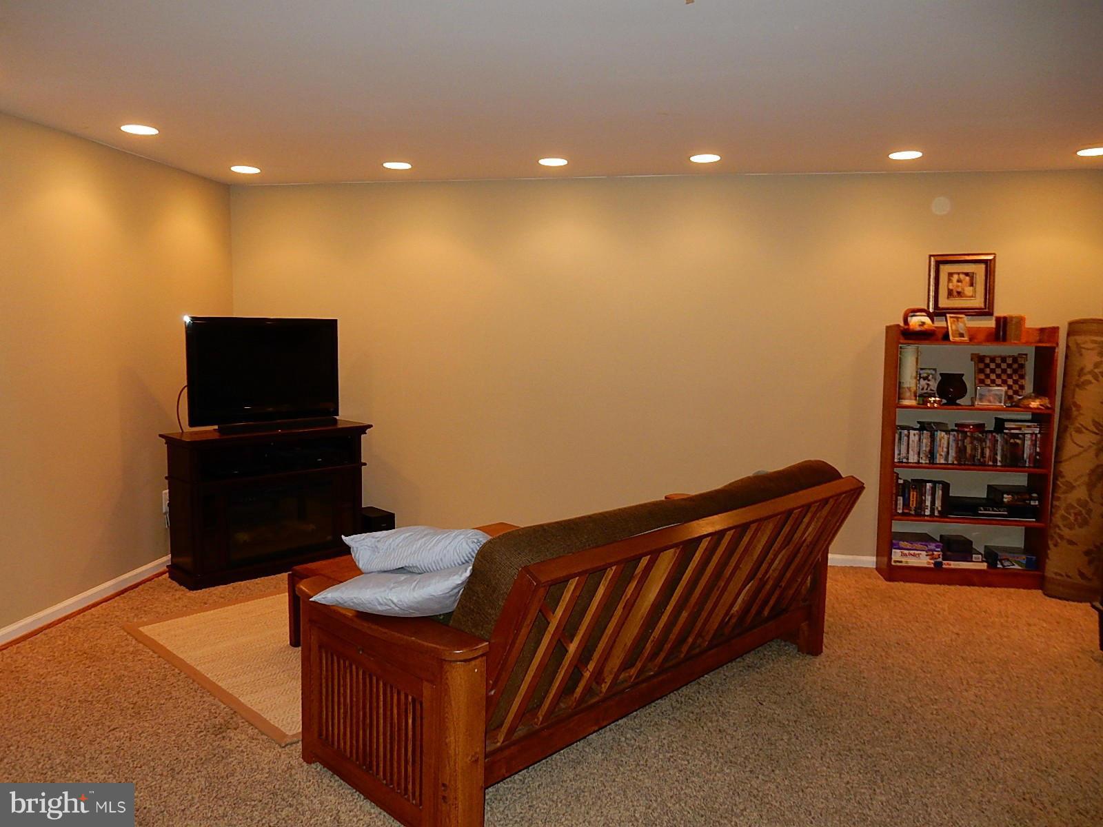 325 Millbrook Terrace Leesburg, VA 20176 - Photo 17 of 20 a living room with furniture and a flat screen tv