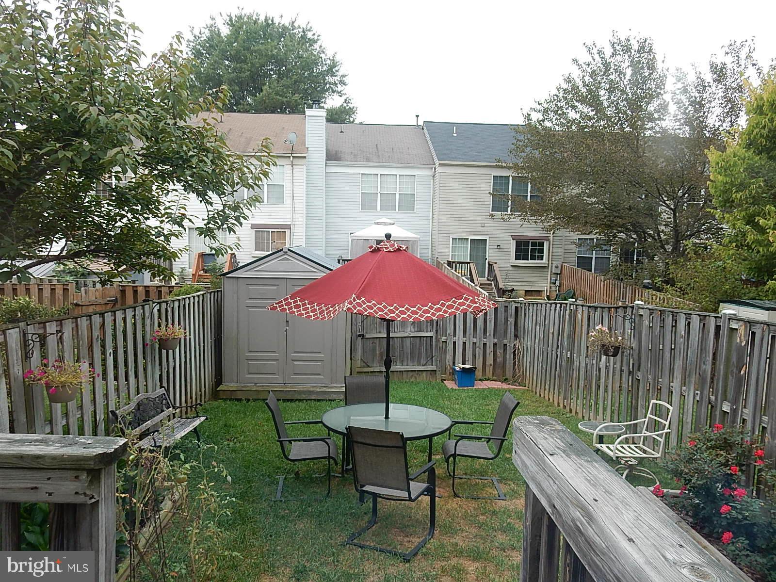 325 Millbrook Terrace Leesburg, VA 20176 - Photo 19 of 20 a view of a chair and table in backyard