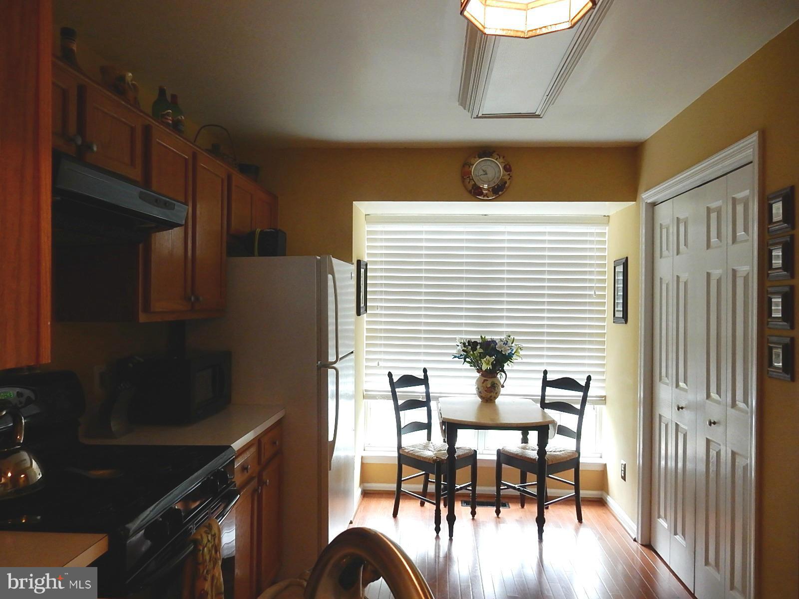325 Millbrook Terrace Leesburg, VA 20176 - Photo 4 of 20 a dining room with furniture and wooden floor
