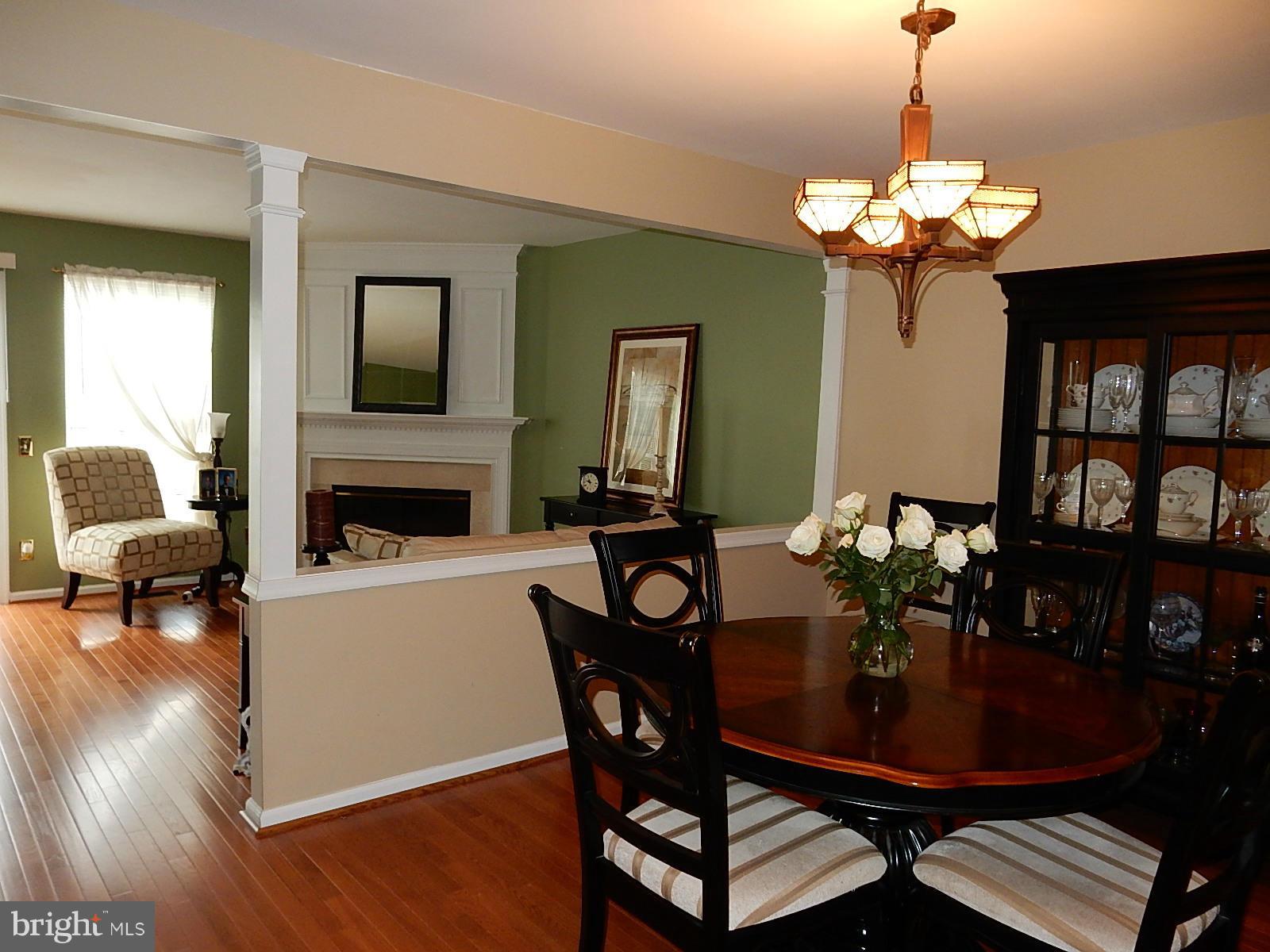 325 Millbrook Terrace Leesburg, VA 20176 - Photo 7 of 20 a view of a dining room with furniture and wooden floor