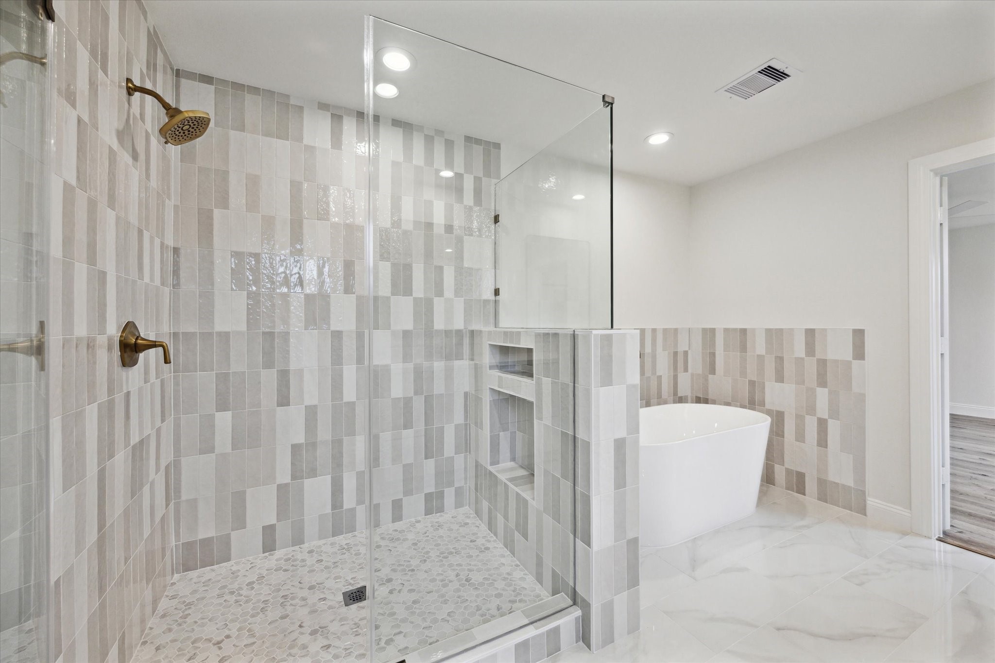 1935 Willow Road Wallis, TX 77485 - Photo 23 of 34 Elegant, modern tiled shower with glass enclosure.