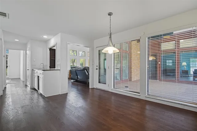 a view of a room with gym equipment and windows