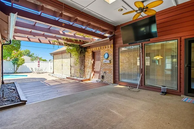 a view of a room with wooden floor and windows