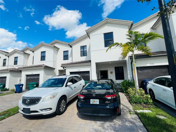 a car parked in front of a house