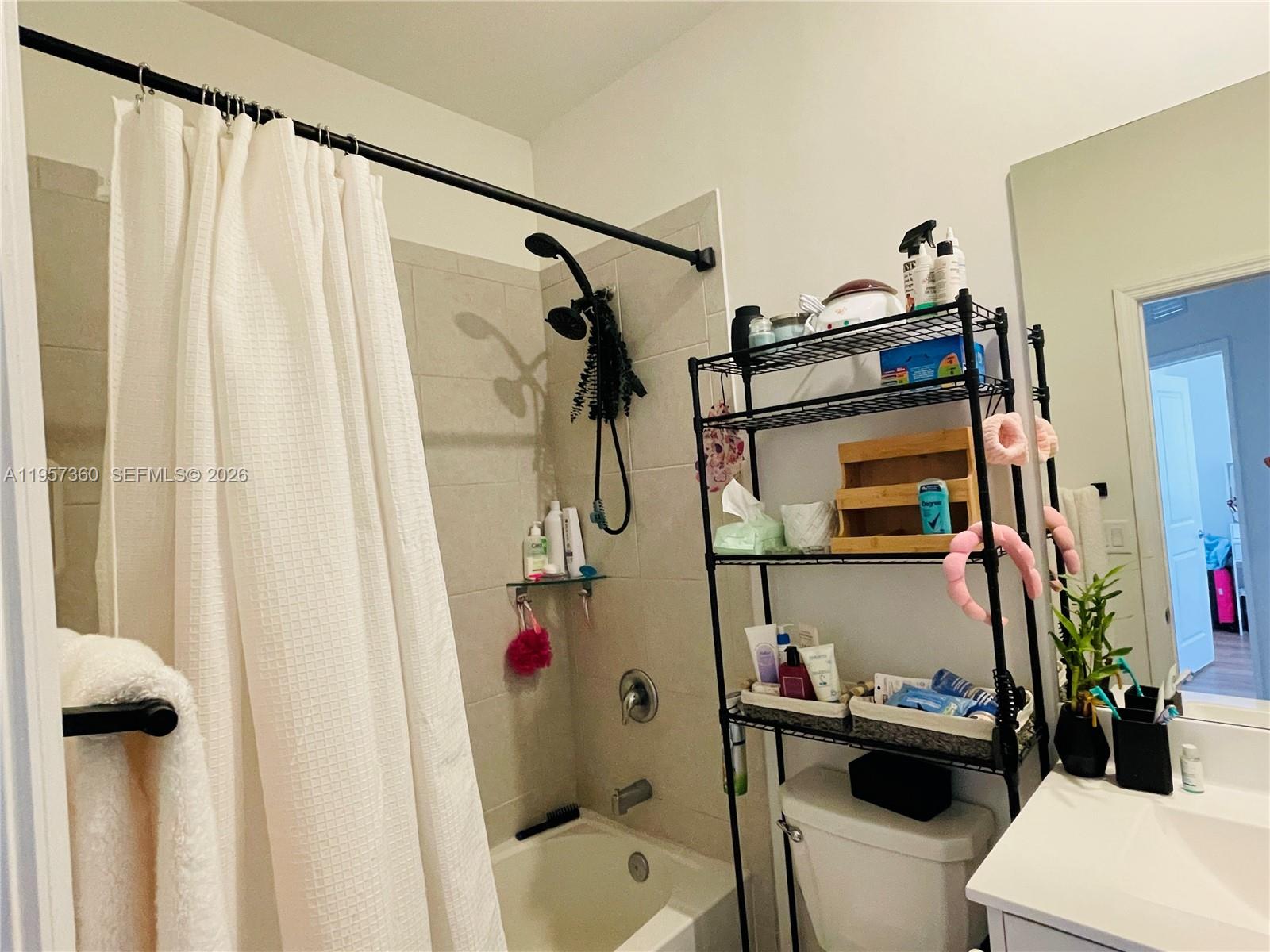 23153 Southwest 128th Place Miami, FL 33177 - Photo 13 of 22 a bathroom with a sink toilet and shower