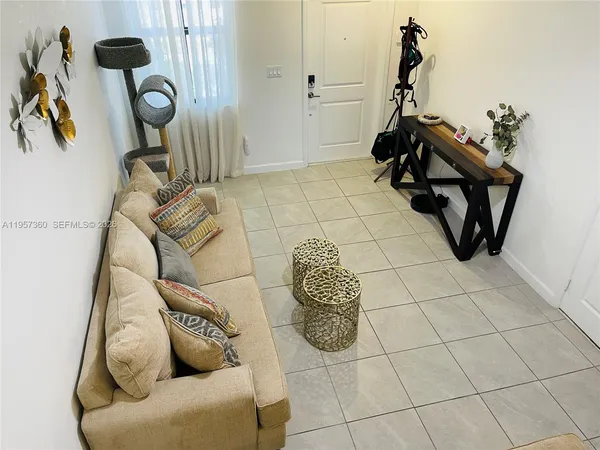 a kitchen with a sink a refrigerator a stove a washer dryer and a dining table