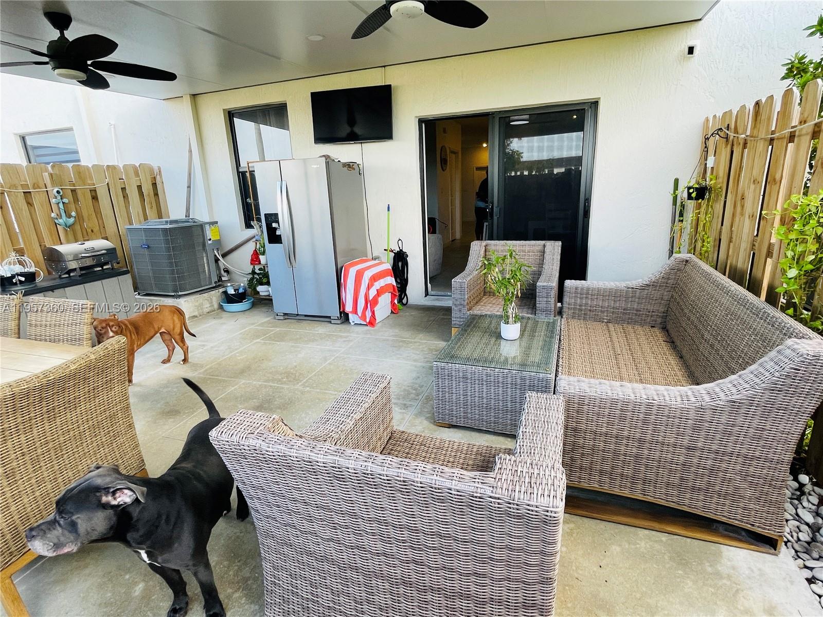 23153 Southwest 128th Place Miami, FL 33177 - Photo 18 of 22 a living room with furniture and a flat screen tv