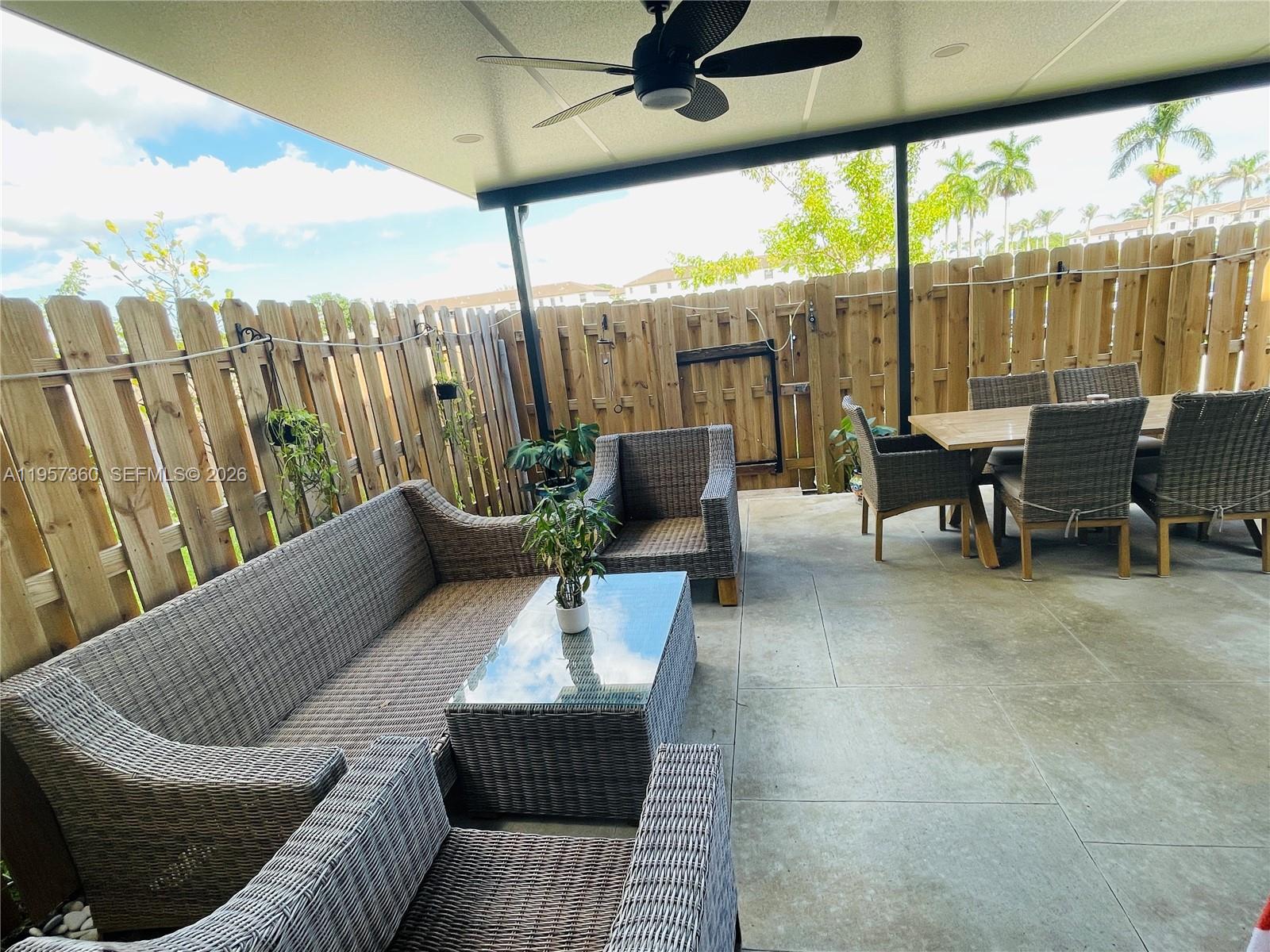 23153 Southwest 128th Place Miami, FL 33177 - Photo 19 of 22 a outdoor living space with furniture and garden view