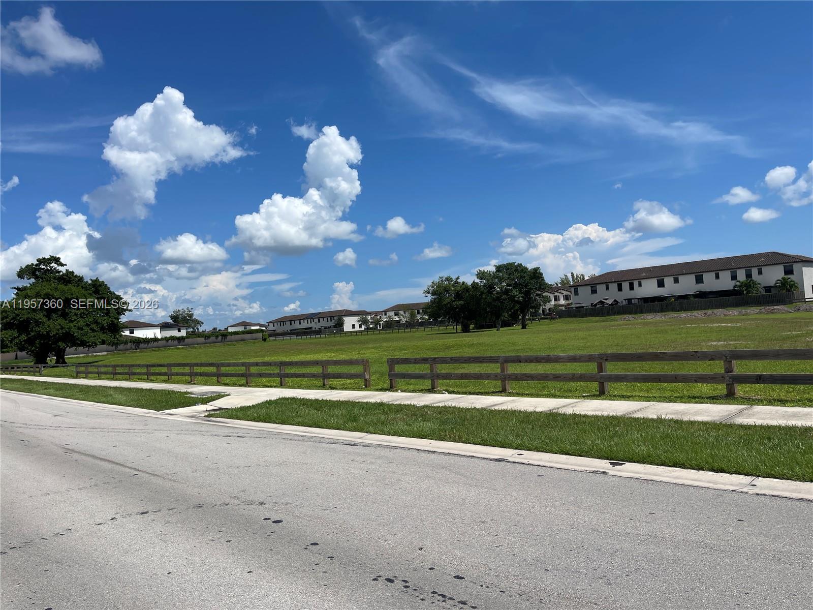 23153 Southwest 128th Place Miami, FL 33177 - Photo 22 of 22 a view of a golf course with a lake