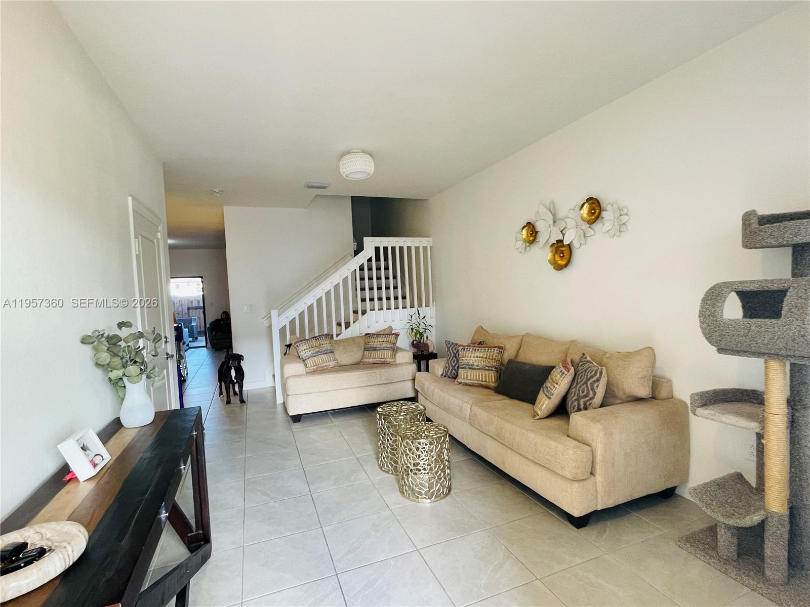 23153 Southwest 128th Place Miami, FL 33177 - Photo 5 of 22 a living room with furniture and a chair