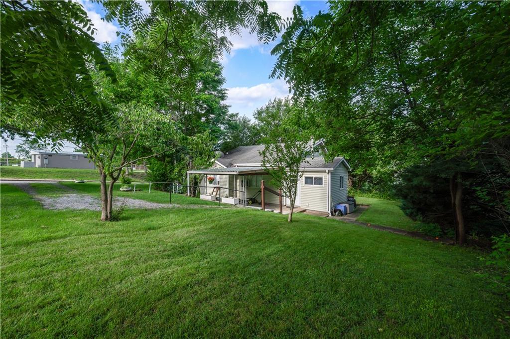 411 Harmony Road Baden, PA 15005 - Photo 1 of 25 a house that is sitting in the grass