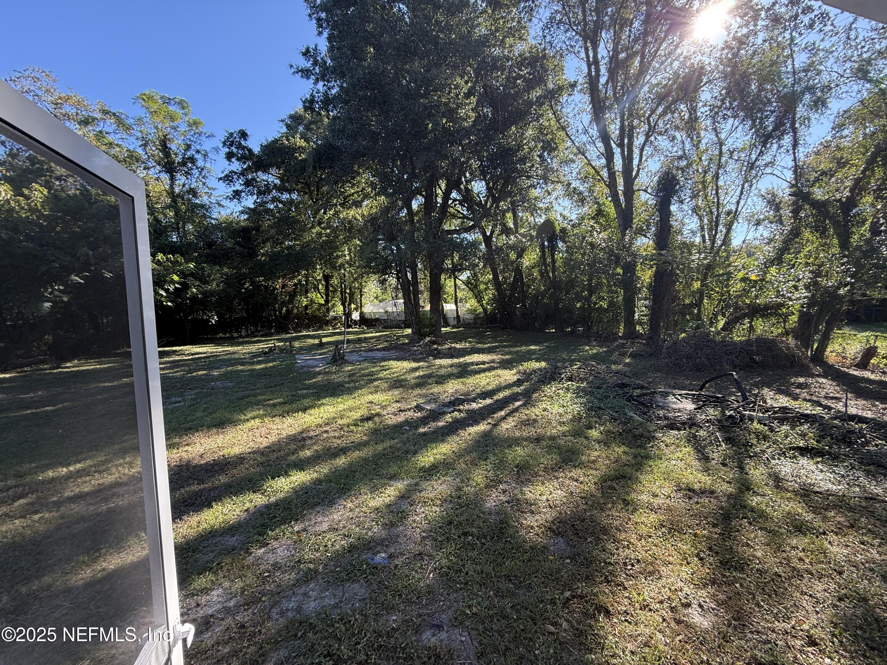10563 Arendal Road Jacksonville, FL 32218 - Photo 11 of 11 a view of a yard with wooden fence