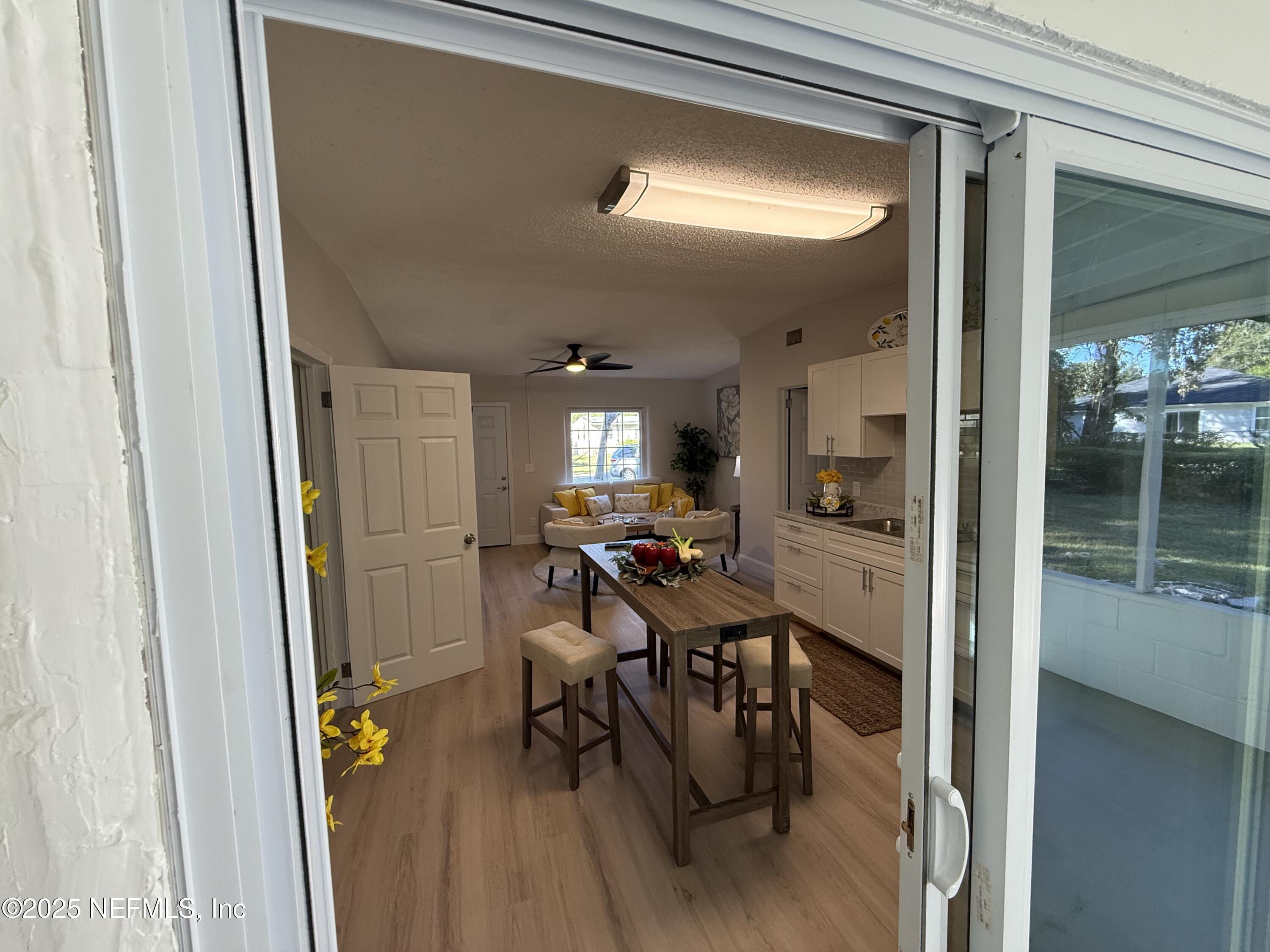 10563 Arendal Road Jacksonville, FL 32218 - Photo 9 of 11 a view of a hallway and dining room