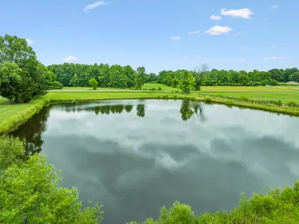 a view of a lake with a big yard