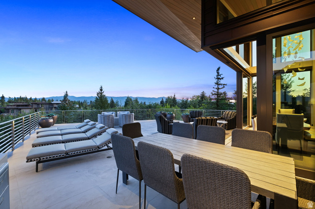 8544 North Promontory Ranch Road Park City, UT 84098 - Photo 11 of 36 Patio terrace at dusk with a patio area, a mountain view, and outdoor lounge area