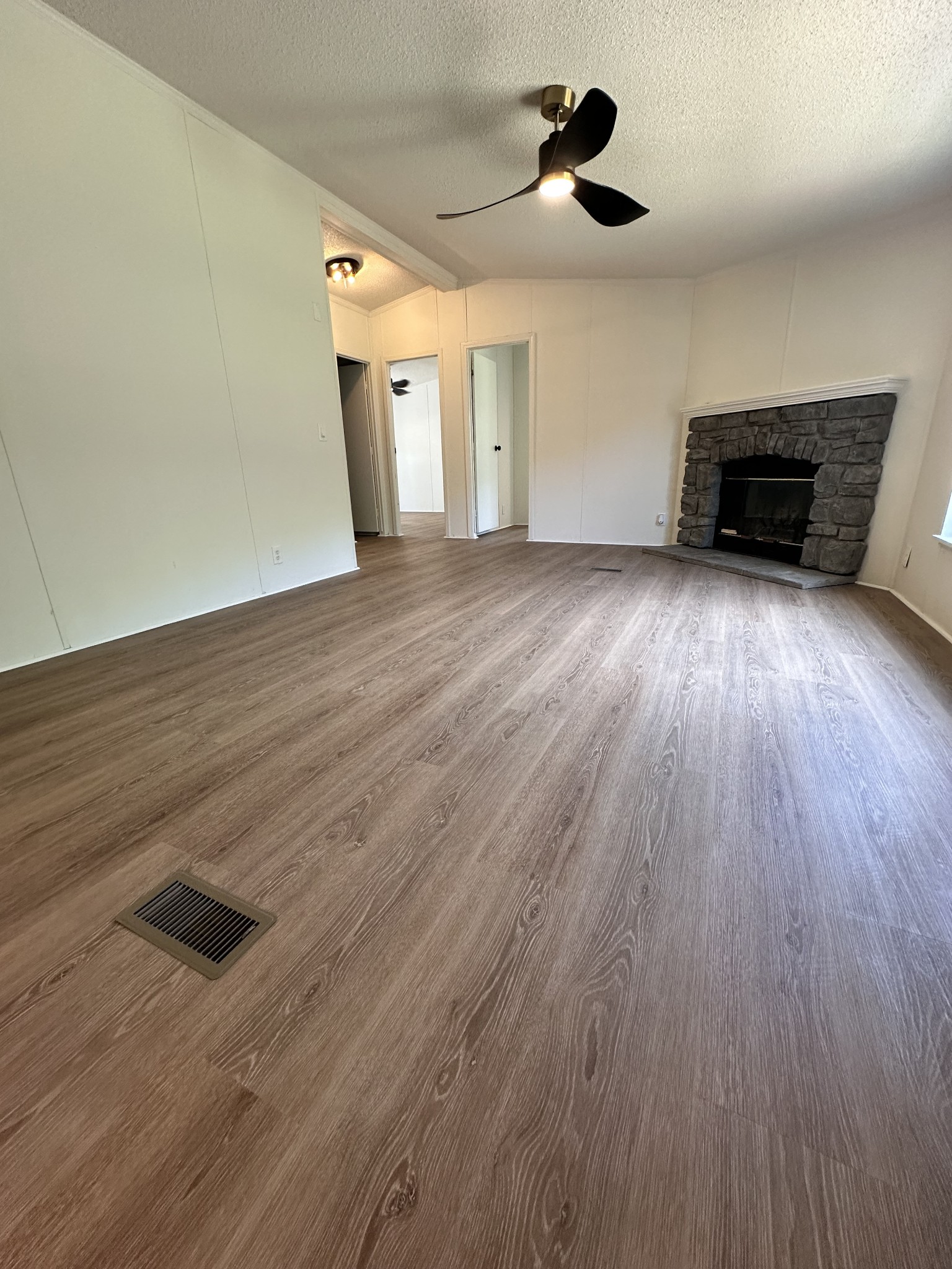7287 Pinewood Road Nunnelly, TN 37137 - Photo 11 of 18 an empty room with wooden floor and windows