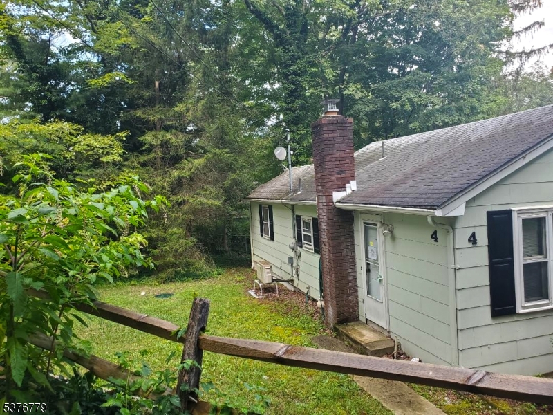 4 Village Place Oak Ridge, NJ 07438 - Photo 15 of 15 a view of a house with backyard and garden