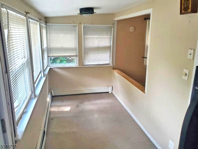 4 Village Place Oak Ridge, NJ 07438 - Photo 5 of 15 a view of an empty room and a window